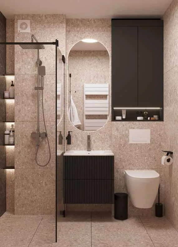 Baie cu pereți din terrazzo în ton de nisip, oglindă ovală luminată, mobilier negru cu fronturi striate și nișe luminate în duș.